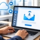 User sending a welcome email for MyCloud UCaaS portal access on a laptop with cloud communication icons.